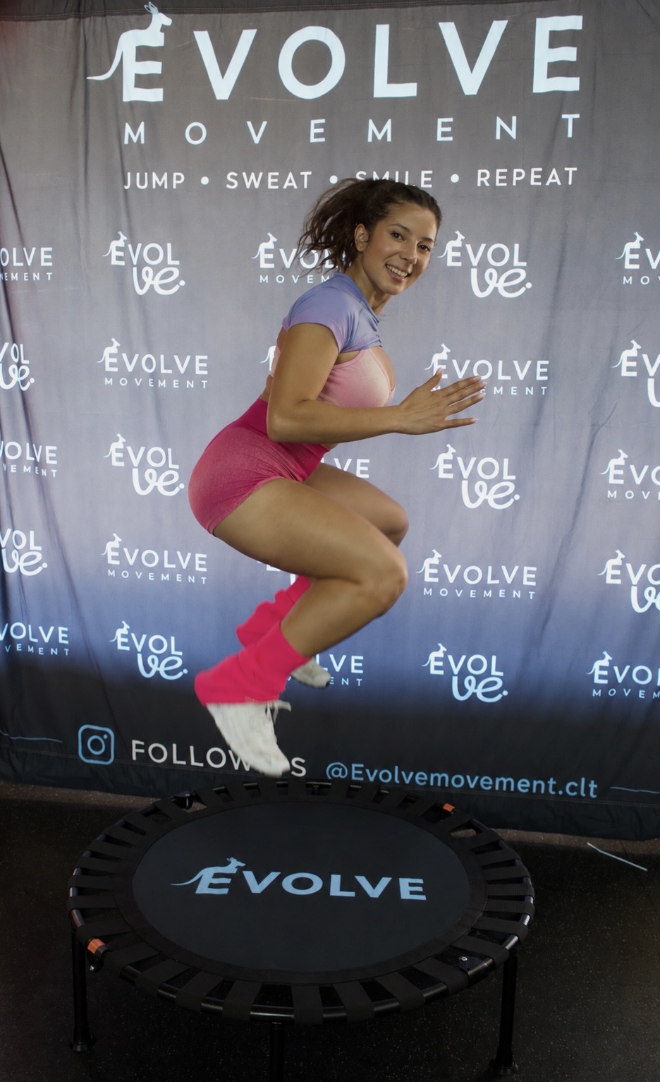 Fitness trainer demonstrating exercise